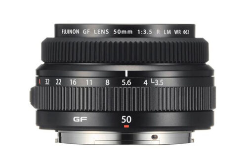 Fujifilm GF 50mm F3.5 lens on a white background without caps.