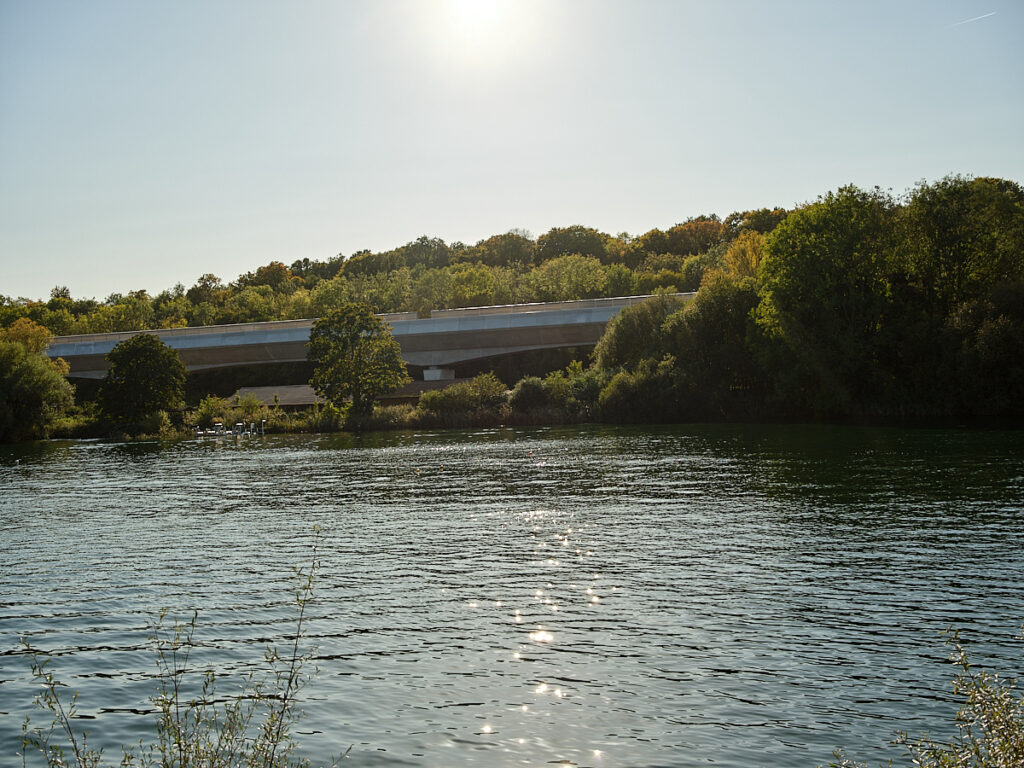 A lake is shown with some slight glare.