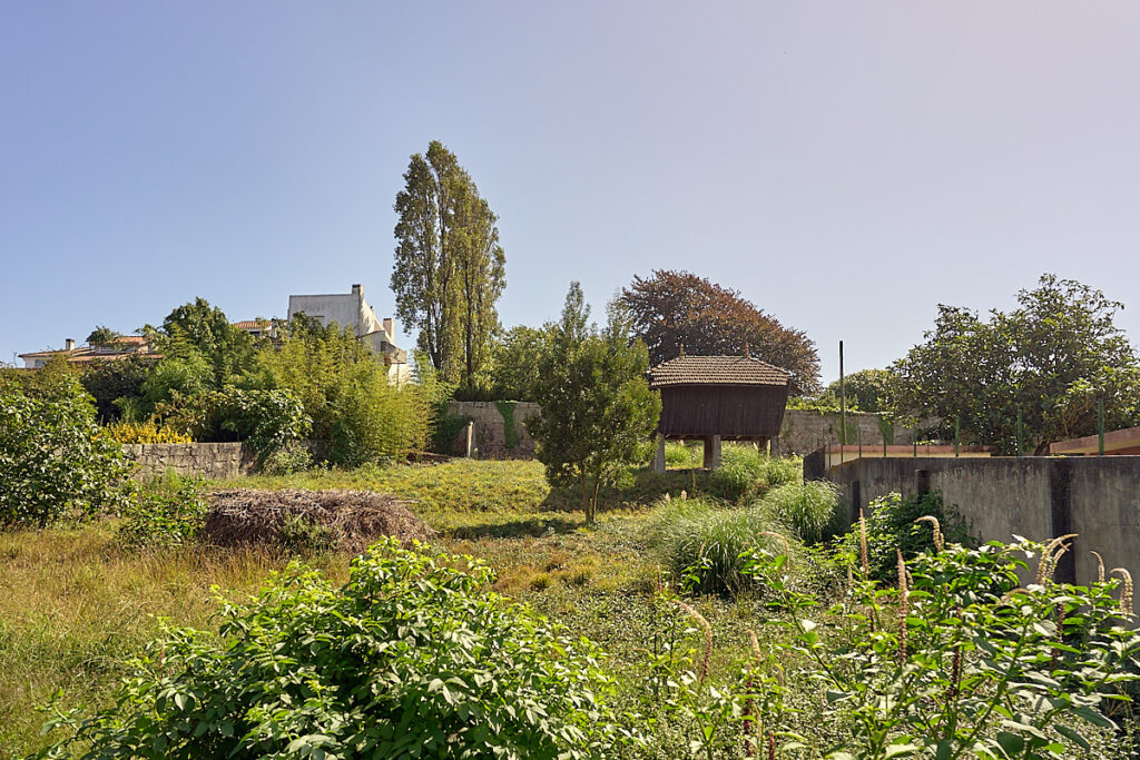 Picture shows an elevated barn on brick stilts. 
