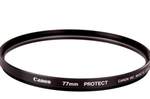 Glass 'Protector' filter made by Canon on a white background.