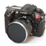 DSLR camera and lens on a white background