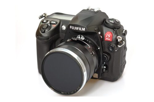 DSLR camera and lens on a white background