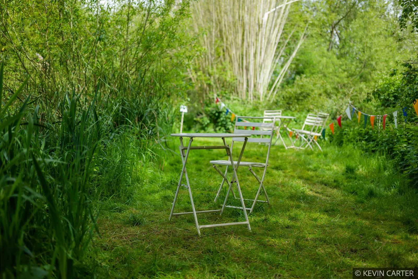 Table and chair beside a river