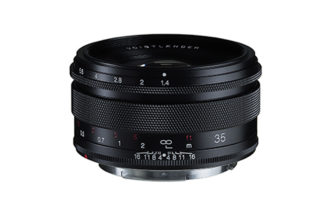 Voigtländer 35mm F1.4 RF lens on a white background